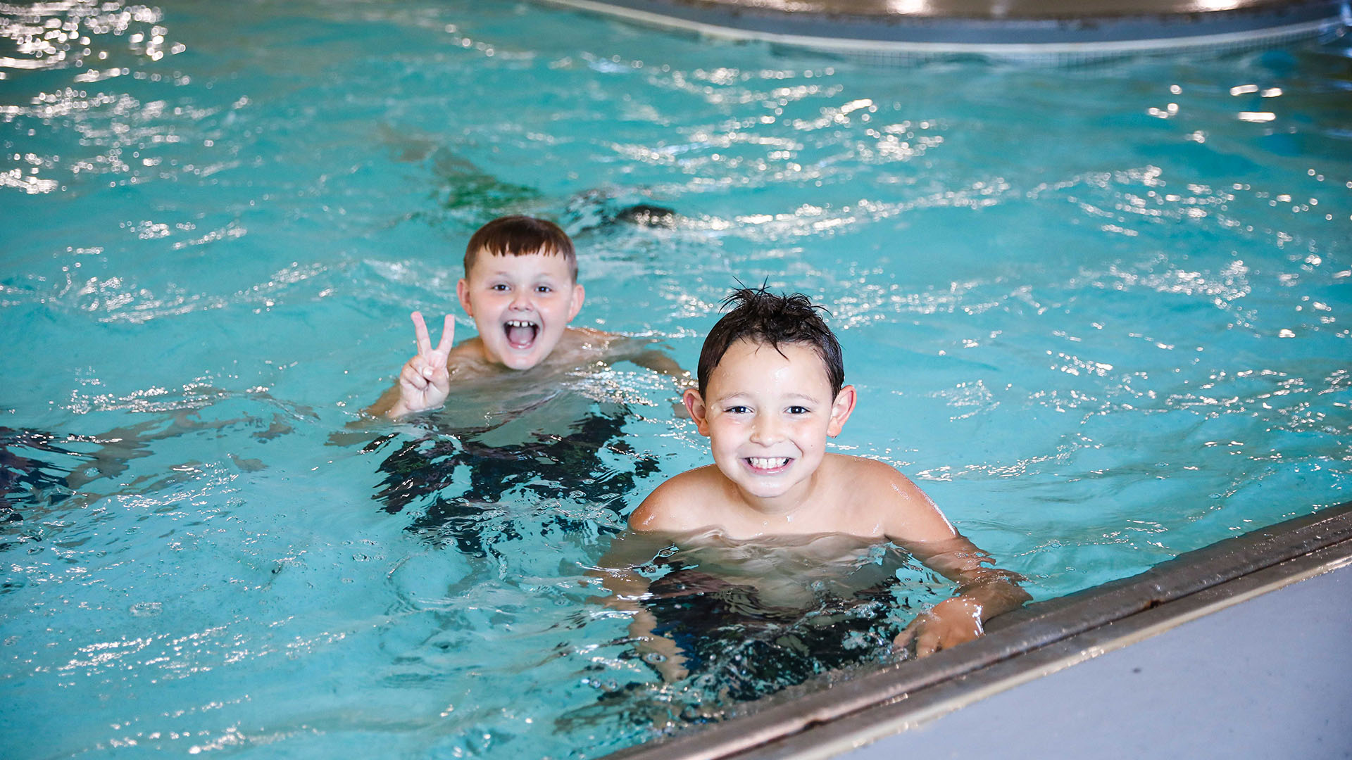 two kids playing in swimming pool one of the activities at greatplay
