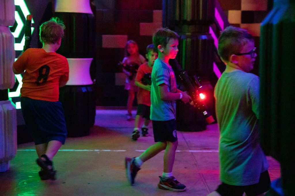 kids playing laser tag at greatplay in north topeka during camps over the summer