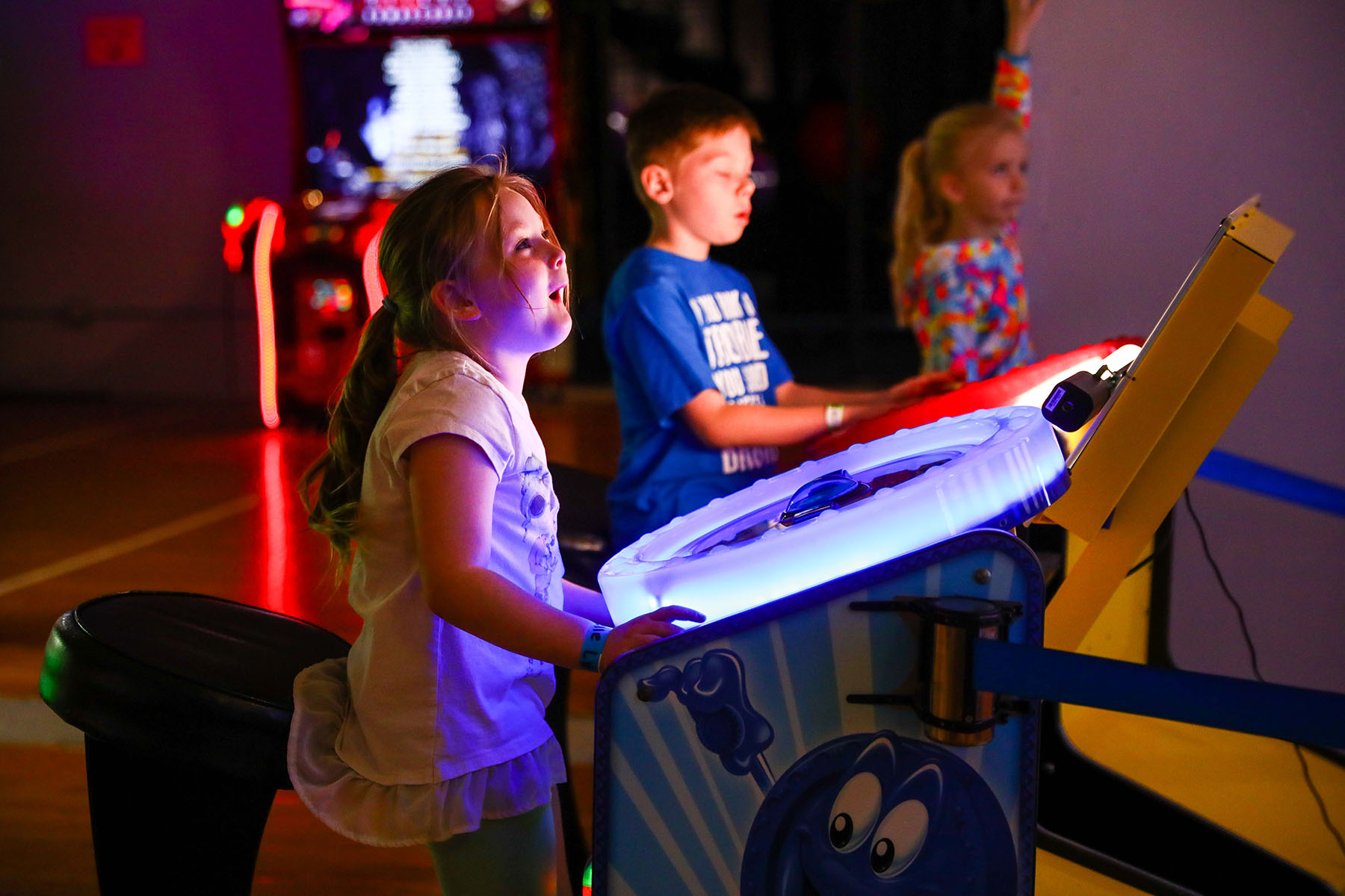 Two kids having fun playing arcade games at GreatPLAY.